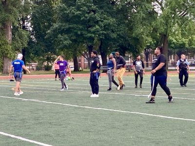 Playing flag football with youth and SLAM at Community, Connection, Culture, a weekly space for Austin residents to learn about local services and engage in healthy family activities