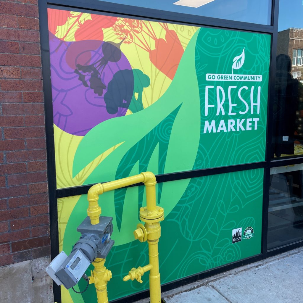 Go Green Community Fresh Market sign